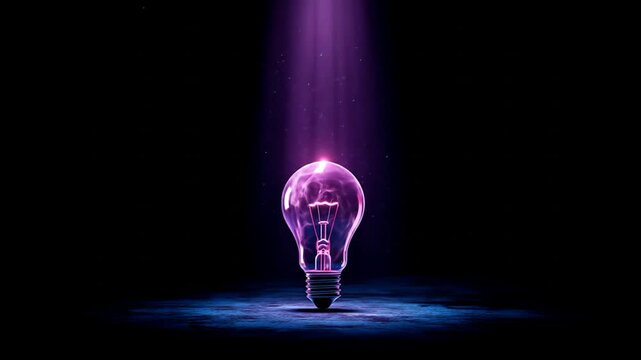 Glowing light bulb idea concept in purple light on dark background
