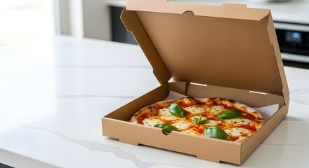 Freshly baked pizza in an open delivery box placed on a pristine kitchen counter, highlighting the convenience of take-out food concept