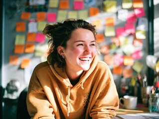 Inspiring young woman creates in a colorful home office space embracing creativity with vibrant notes indoors