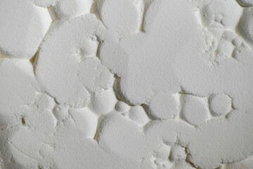 Close up of Abstract Background of Light Textured Powder