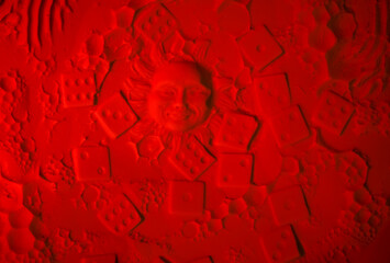 Close up of Abstract Red Background of Light Textured Powder and Sun Face