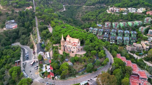 Epic Barcelona fairy castle aerial orbit. 
Cinematic 4K drone panorama of historic 
modernist Casa Arnus palace and historic 
funicular railway on Tibidabo hill.

