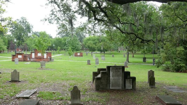 Colonial Park Cemetery in the historic district of Savannah, Georgia. Smooth camera movement, walking by or panning right.