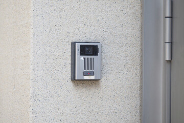 Security camera mounted on wall for monitoring activities