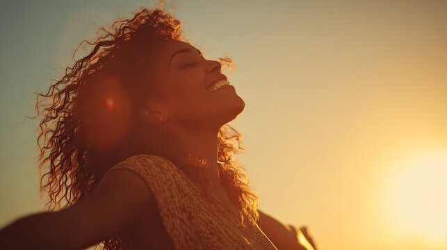 A joyful Black woman with curly hair, embracing the golden sunset with arms open wide, her silhouette backlit by sunlight flares, evoking the freedom and joy of Africa's Day of Freedom.
