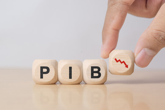 Businessman hold the wooden block with PIB icon, Concept of economic crash