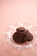 Crunchy Chocolate Biscuits on Pastel Pink Surface
