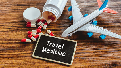 Obraz premium Travel Medicine Preparations: Airplane, Pills, and Bottle Representing Healthcare and Vaccination for International Trips