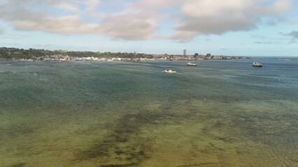 A large tropical harbour near a big town.