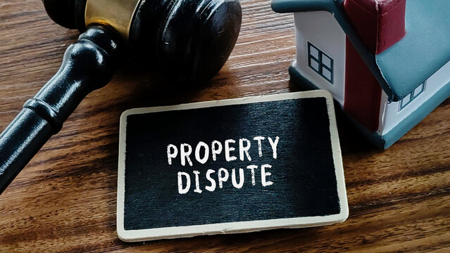 Property Dispute Legal Concept on Chalkboard with Gavel and Miniature House