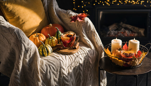 Cozy autumn pumpkins and candles on bed. - Powered by Adobe