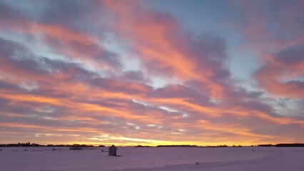 beautiful summer sunset over the lake in Saskatchewan Canada on a rural farm