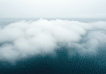 Obraz premium Dense white fog rolls over the deep blue sea creating a mysterious, isolated, and serene natural landscape perfect for backgrounds or covers ,surface ,weather ,mysterious