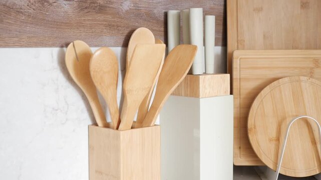 Wooden kitchen tools and cutting boards on display