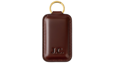 High-quality dark brown leather key fob accessory with gold ring for luxury catalog marketing. isolated PNG with Transparent Background
