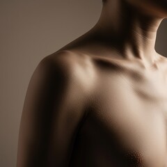 Close-up view of the upper torso and curved shoulder structure against a smoothly blurred, neutral background emphasizing composition and space ,focus ,body ,detail