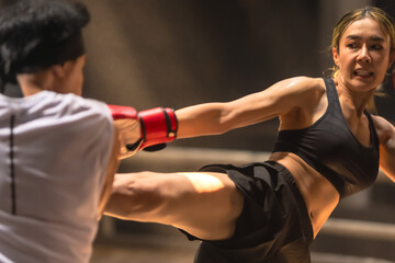 Muaythai boxer woman training Thai boxing with male trainer