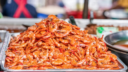 Pile of sweetened cooked small shrimp or Kung Wan at Thai street food market.