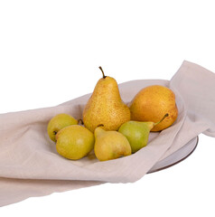 Studio photo of ripe pears arranged on a plate lined with white parchment paper against a clean light background.