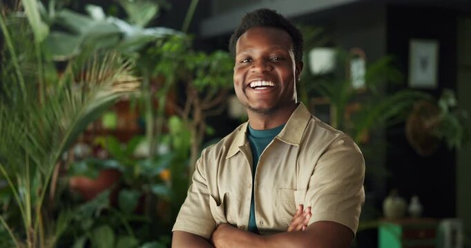 Crossed arms, black man and face of botanist in nursery with confidence for eco friendly career. Happy, laugh and portrait of African environmental consultant by greenery for botany in garden center.