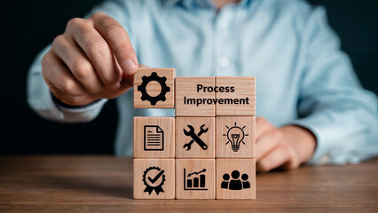 Obraz premium Strategist strategically places wooden block symbolizing gear to achieve successful process improvement and business goals