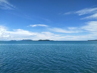 Blue Sea and Green Hills Landscape