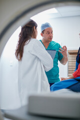 Mri machine, patient or doctors with tablet for test results, discussion or medical advice for...
