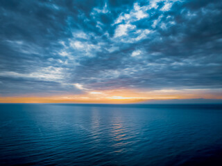 Sunrise at the Seaside with rain clouds