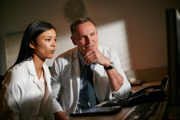 Night, doctor and people in hospital, coaching and planning with help, discussion and healthcare. Mentor, medical service or employees in clinic, coworking or support with online reading and talking