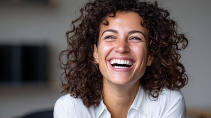 Woman smiling in office setting.