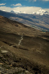 Aerial of the Wakhan Corridor in Afghanistan Tajikistan border , rugged Pamir Hindu Kush mountains, winding glacial rivers and remote high altitude valleys