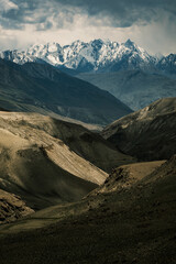 Aerial of the Wakhan Corridor in Afghanistan Tajikistan border , rugged Pamir Hindu Kush mountains, winding glacial rivers and remote high altitude valleys