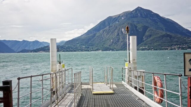 Lake pier and metal dock with defocused mountain and water background outdoor; backdrop copyspace backplate calm.