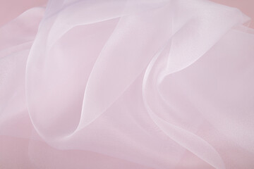 Beautiful soft air waves of white organza. Light, transparent white silk surface. A sample of delicate silk, organza. wedding reception