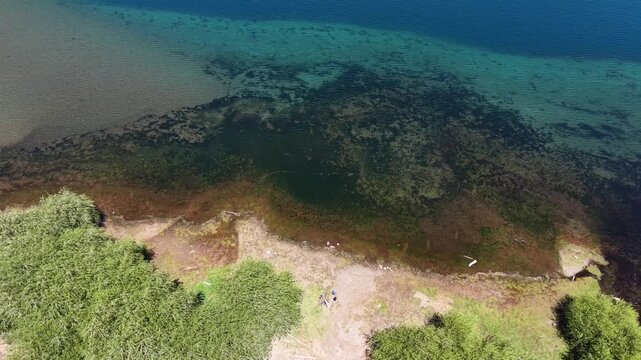 Lake Puelo in the province of Chubut. Crystal-clear waters. The drop-off appears smooth thanks to the drone footage. 4k