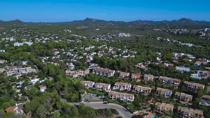 Real estate developments near Cala Murada in Mallorca, Balearic Islands. Highlights private villas, hotels, and the natural beauty of the Mediterranean coastal landscape.