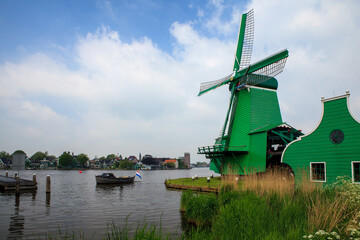 Fototapeta premium Windmills near Dutch village
