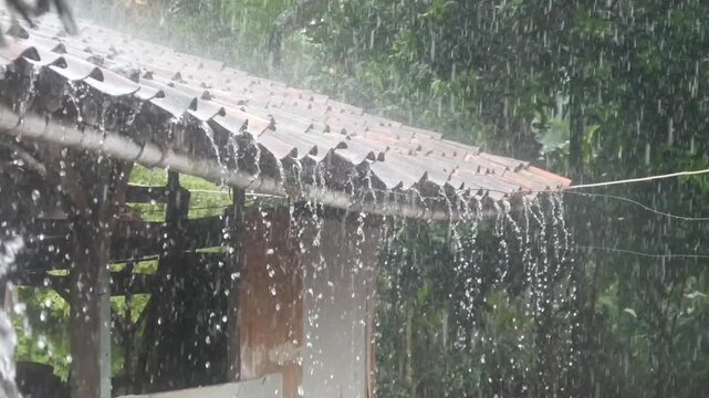 heavy rain falling on the roof tiles of traditional houses