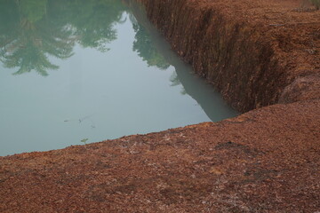 Red natural pebbles create a striking earthy texture, enhancing landscapes with vibrant color and rustic beauty.