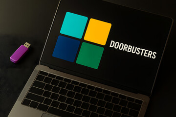 Laptop screen displaying "DOORBUSTERS" logo with a purple USB drive