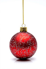 Sparkling red christmas ornament hanging on gold string