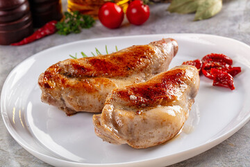 Roasted rabbit leg served rosemary