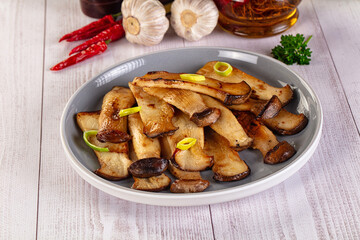 Roasted eringi mushrooms in the plate