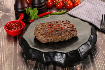Grilled beef burger cutlet with sauce
