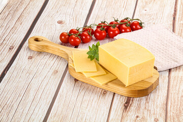 Yellow cheese piece with slices