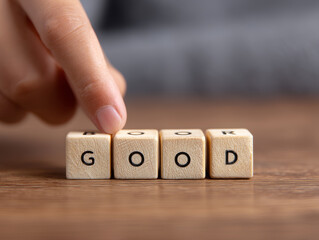 Good choice decision quality improvement change concept finger hand wooden cube block letter text word message option selection switch toggle transformation progress positive upgrade contrast