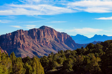 Beautiful Late Afternoon Sky over the Stunning Red Rocks of Zion National Park while Driving Kolob Terrace Road in Utah in Autumn.