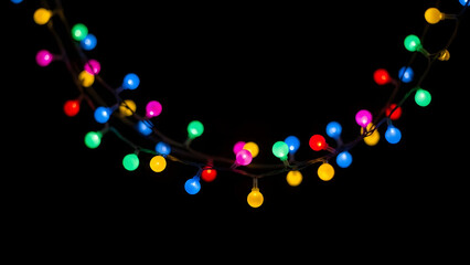 Colorful string lights glowing against a dark background