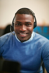 Headset, black man and portrait of call center agent in office with CRM, communication or...