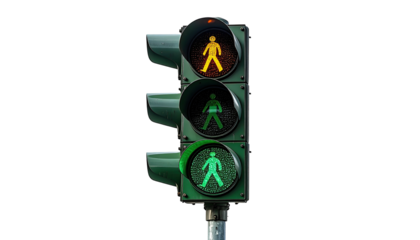 Pedestrian traffic signal with yellow and green lights active